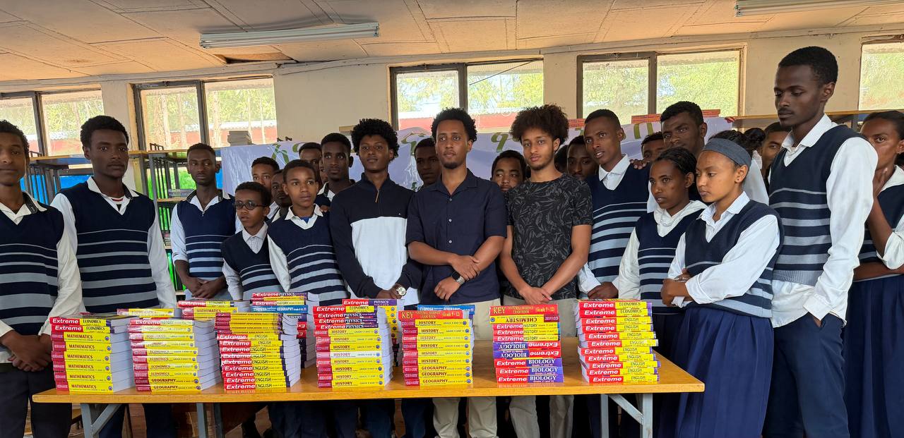 Students and volunteers with donated textbooks