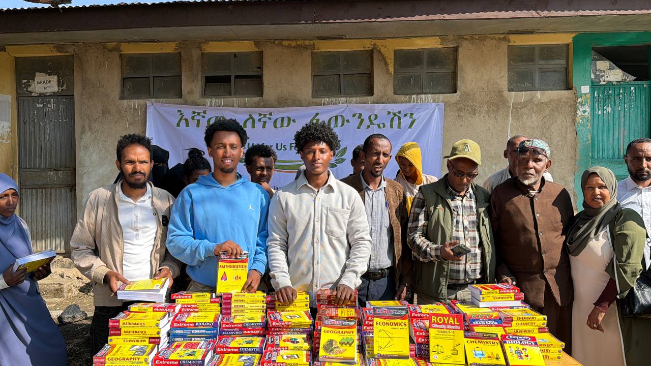 Community members with donated textbooks